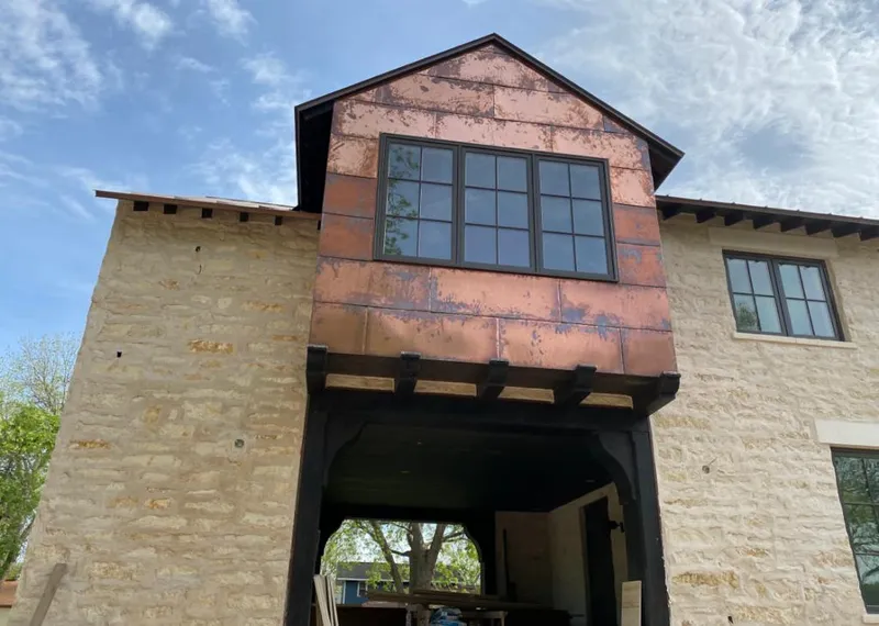 Copper metal panel facade on a stone building for Skylight Installation in Broadview Heights